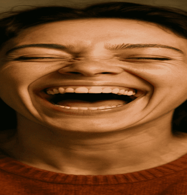a close up picture of someone laughing her heart out