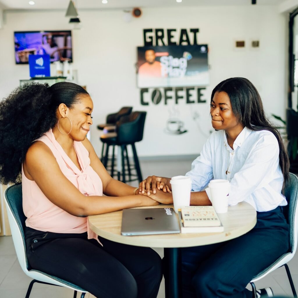 Compassionate gesture during sensitive conversation about mental health