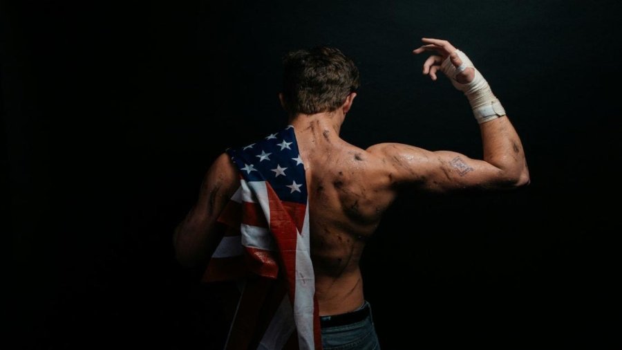 a man with an american flag on his back