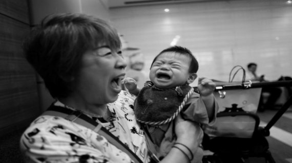 A woman holding a baby in her arms