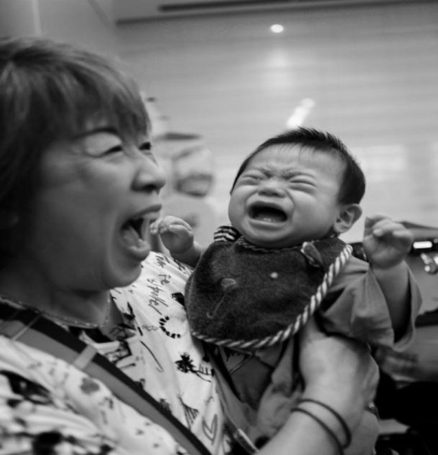 A woman holding a baby in her arms