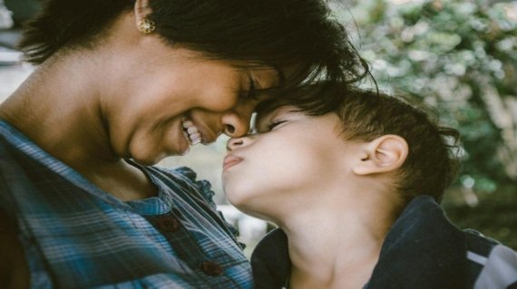 selective focus photography of woman and boy