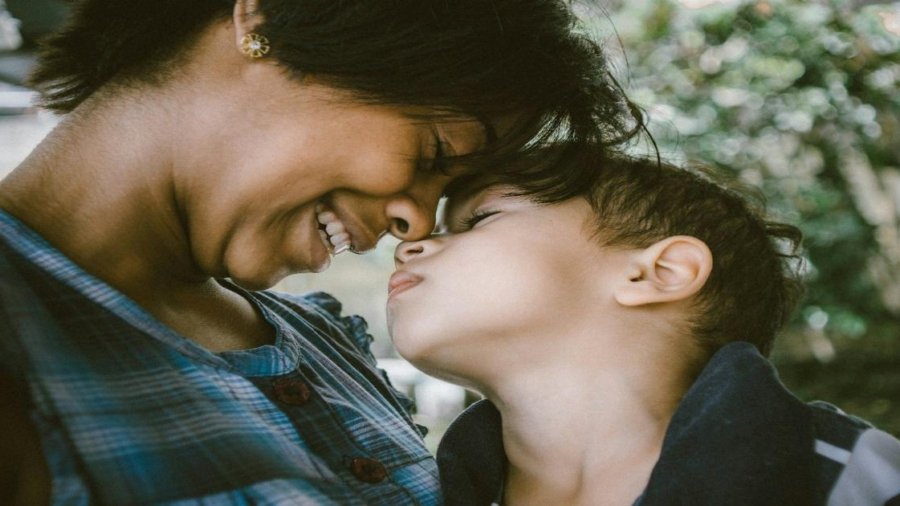 selective focus photography of woman and boy
