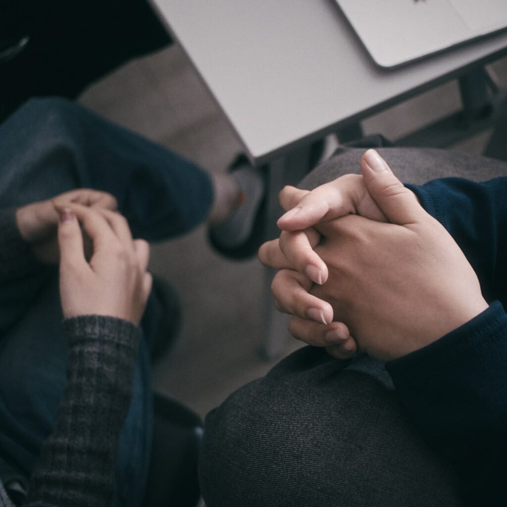 Two people are holding hands.
