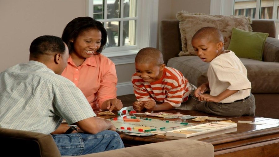family playing board games