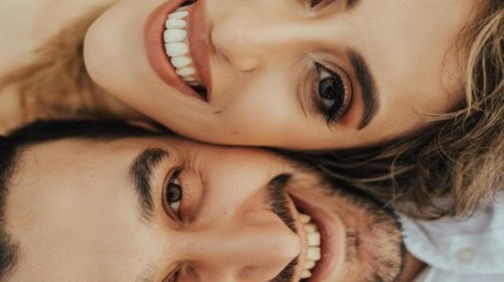a man and woman taking a selfie