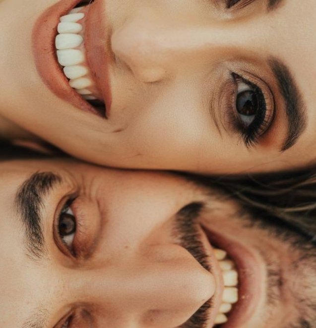 a man and woman taking a selfie