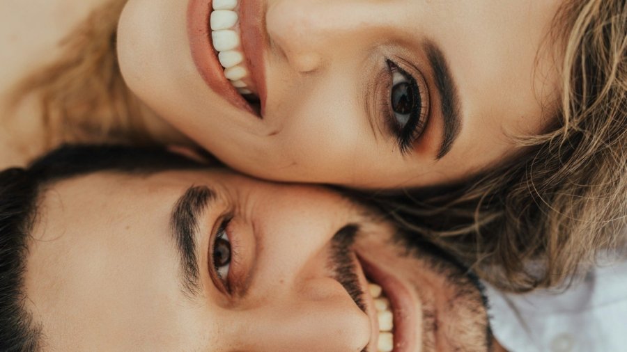 a man and woman taking a selfie